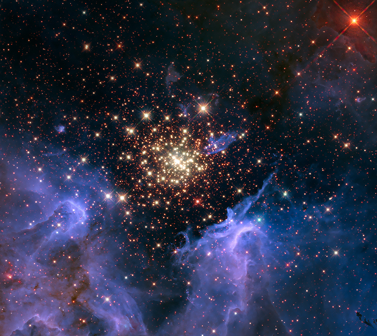 a star cluster in NGC 3603 surrounded by clouds of gas and dust