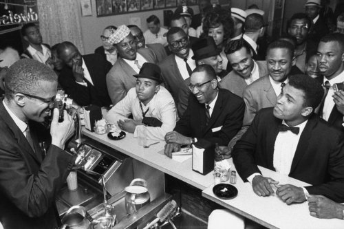 twixnmix: Muhammad Ali celebrating with Malcolm X at the Hampton House in Miami after he won the Wor