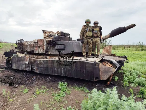 Russian Soldiers Pose With A Destroyed Ukrainian M1A1 Abrams