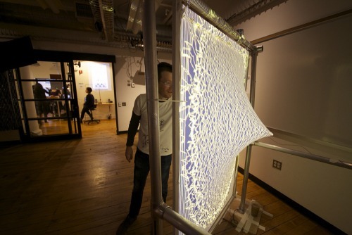 wetheurban:  DESIGN: Firewall by Aaron Sherwood Artist Aaron Sherwood creates magic as a sheet of spandex becomes a tactile membrane the public can interact with. The surface creates amazing fire-inspired visuals and music as visitors push their hands