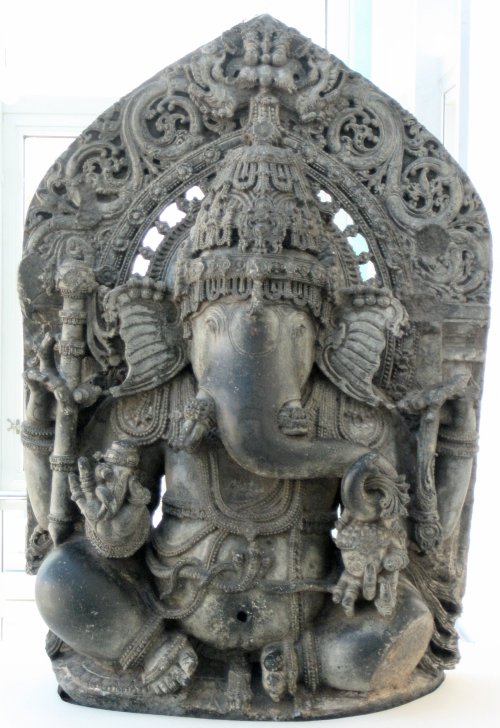 Seated Ganesha (schist), from Karnataka state, India.  Artist unknown; 13th century.  Now in the Asi