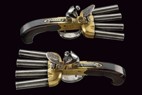 A matching pair of English flintlock duckfoot volley pistols, 18th century.