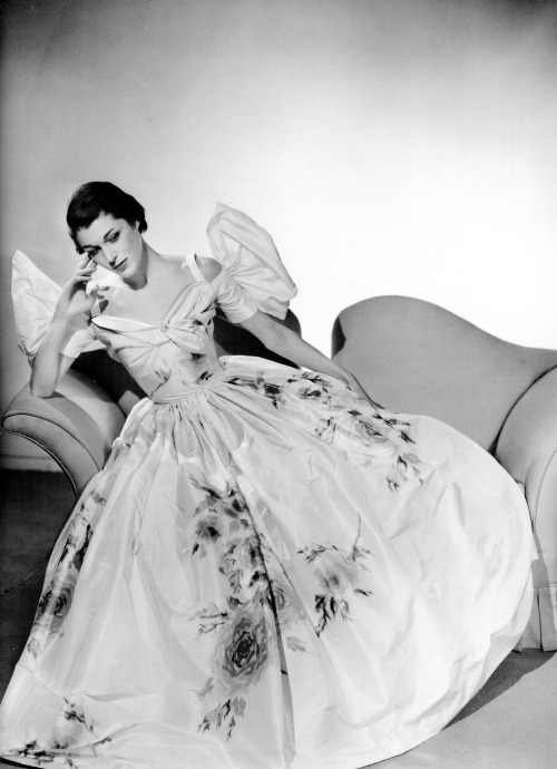 A model wearing a gown by Hollywood costume designer Adrian photographed by John Engstead, 1952