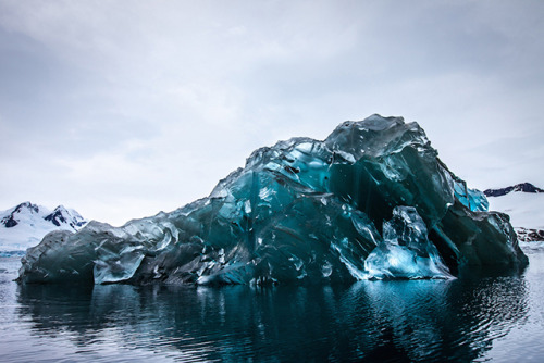 sixpenceee:Photographer Alex Cornell captures rare pictures of an upside down ice burg. 