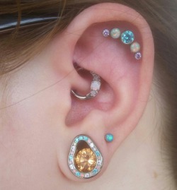 also here’s a picture of my eari have my other daith done on the other ear too but i don’t have any current pics, so all that’s there is an industrialI’ve got an anatometal 5 gem cluster, anatometal 7/16ths plugs, neometal blue opal studs (replacing