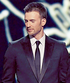 natashamaximova:  Chris Evans │ Academy Awards 2013  Chris being charming. And