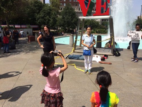 thatblackveganguy:  ras-al-ghul-is-dead:  A silent protest in Love Park, downtown Philadelphia orchestrated by performance artists protesting the murder of Michael Brown in Ferguson. The onslaught of passerby’s  wanting to take photos with the statue