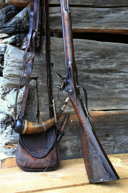 Some contemporary made replica 18th century itemsLong rifle by Ian PrattLeather bag by Maryellen Pra