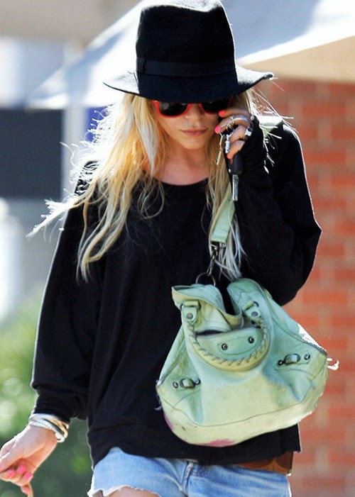 olsendaily:Mary-Kate and her mint green Balenciaga bag, pictured here from 2004 (when purchased) to 