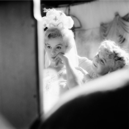 Marilyn Monroe getting ready for a scene for “The Prince and The Showgirl” in 1956. Photo by Milton 