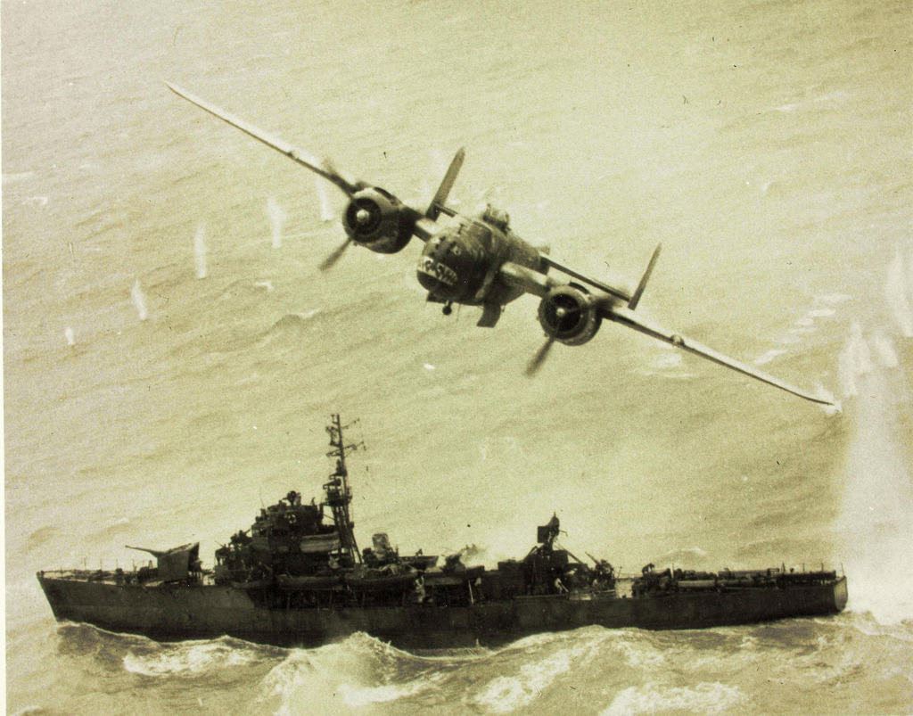 demons:  A B-25 Mitchell strafing a Japanese vessel in the Pacific 