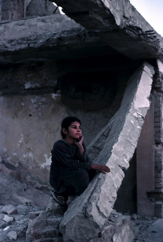 kheirafghanistan:  A young girl stands next to her destroyed house. Many poor families