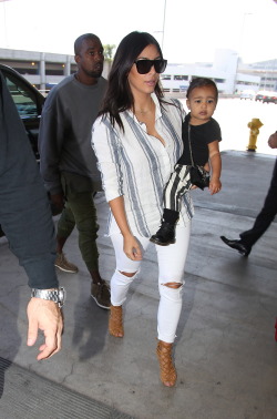 idonotlikeabitchass:  kimkanyekimye:  Kim, Kanye &amp; North arriving at LAX airport in Los Angeles 9/1/14   X