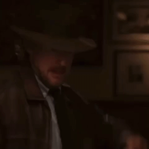 Owen Wilson wearing a hat brings his hand down hard, then the next scene is Tom Hiddleston as Loki winching in pain as he brings himself up to his knees in the time loop. 