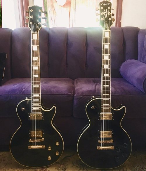 My 2 main guitars.  Right: Circa 2004 Epiphone Les Paul Custom Elitist.  Left: 1978 Lawsuit Les Paul