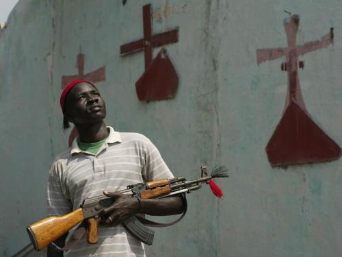 A South Sudanese civilian stands in front of St. Andrew’s Episcopal Church in Bor, South Sudan