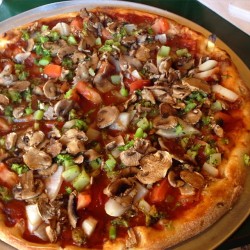 bloominginthemud:Vegan pizza not made by me but devoured by me 😄 they have this place not too far from me that offers vegan pizza, calzones, etc so I got a veggie pizza. Yum!!!