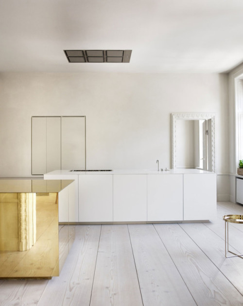 {Minimal, with a little glam and flash! The brass cube is the centre piece in this apartment designe