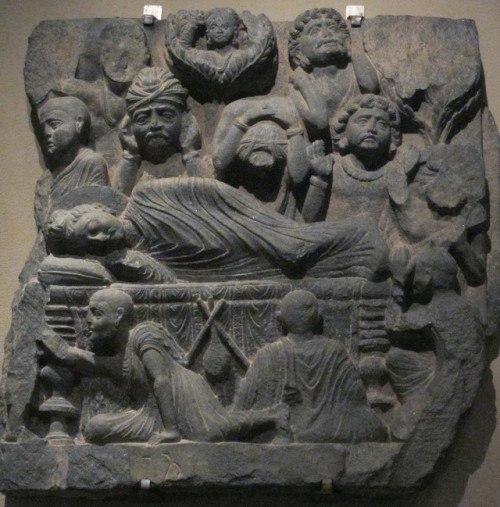 The death of the Buddha.  Schist sculpture from the ancient region of Gandhara (in present-day Pakis