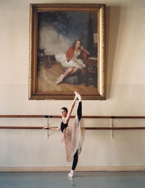 A portrait of famed Russian ballerina Marina Semenova hangs behind student Ekaterina Bondarenko. Vag