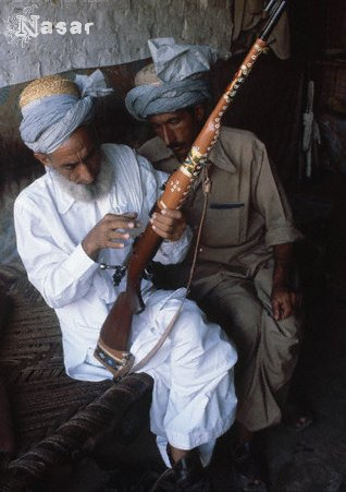 Pashtun men with rifle, Afghanistan circa 1980’s.