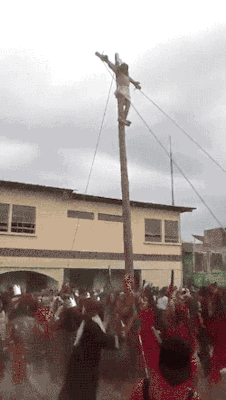 gifsboom:  Jesus falls off cross during Easter crucifixion show.