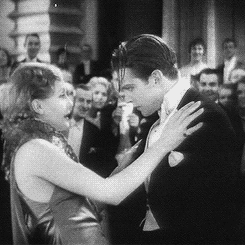 matineemoustache:Douglas Fairbanks Jr. kissing in the style of John Gilbert, with a Greta Garbo look