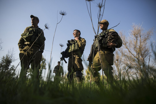 IDF soldiers seen at a point by the Gaza border, near Kibbutz Nahal Oz, in Southern Israel, on Janua