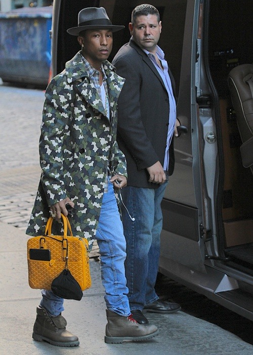 thefashionbomb:  Pharrell rocking a Prada Fall 2010 Camo Trench 