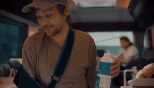 Louis Putting Milk In His Coffee Then Putting The Milk Back In The Fridge On The Tour Bus - X
