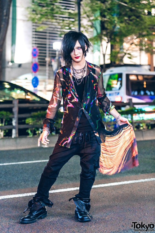 Yukito on the street in Harajuku wearing a colorful top and pants by If Six Was Nine with Midas fold