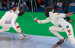 Modernfencing:  [Id: An Epee Fencer Lunging And Hitting Her Opponent, As The Opponent