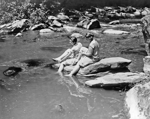 yesterdaysprint: Marion Newton and Ruth Williams preparing to wade in Rock Creek, after suffering wi