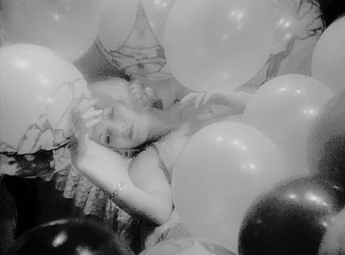 margotfonteyns:Constance Bennett awakening to a boudoir of balloons in Rockabye (1932)