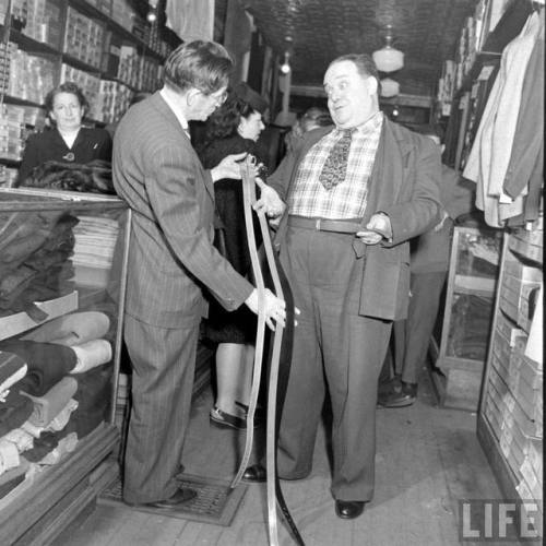 Shopping for belts at Sig Klein’s Fat Men’s Shop(Bernard Hoffman. 1947)