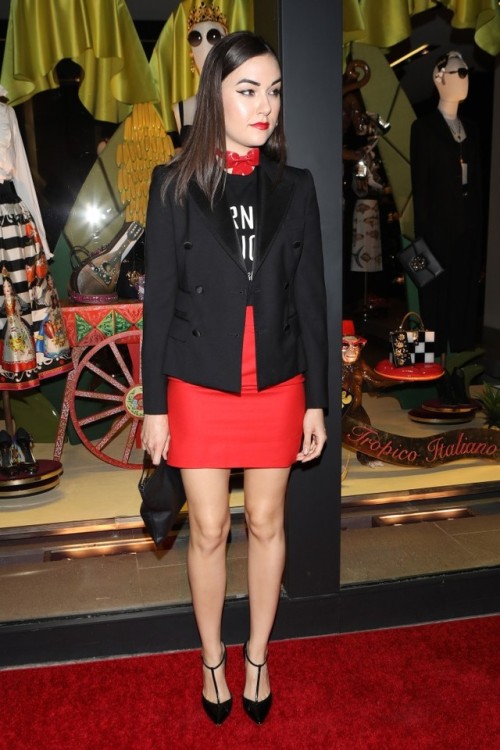 Sasha Grey showing her nice legs in a red mini skirt. Check out more beautiful ladies at http://hotm