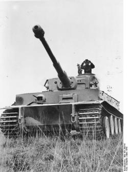 unbekanntersoldat:  A German tank commander surveying a field atop his Tiger I - Russia, 1943.