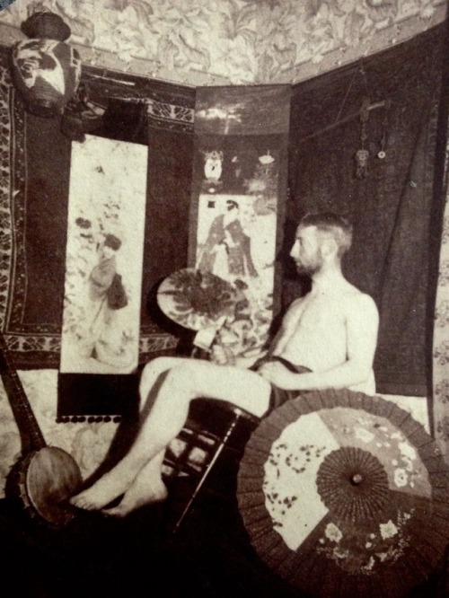 Williams College student in his room. 1889 or 1890. At the height of the aesthetic style of decorati