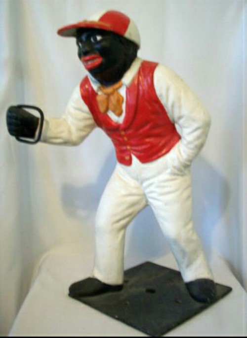 wakeupslaves:  The African-American lawn jockeys often had exaggerated features, such as big eyes with the whites painted in, large red lips, large, flat nose and curly hair. These pieces were typically painted in gaudy colors for the uniform, with the