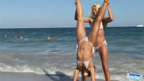 Enjoy these sexy babes posing in their tiny fishnet string bikini www.tubebikini.com/video/79