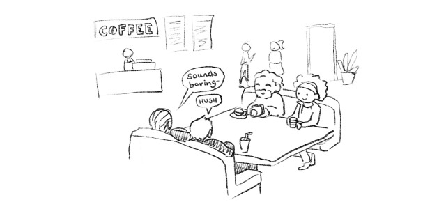 Comic panel 4: We zoom out to see Joe holding the camera. He’s seated in a coffee shop with Nile next to him, and Booker and Andy across from them. They have coffee on the table between them. Booker says “Sounds boring-” and Andy says “Hush”