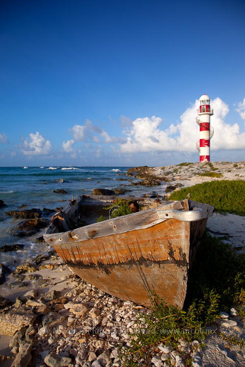 outdoormagic - Lighthouse and rusty boat by Chepe Nicoli