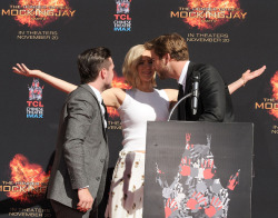 celebriupdates:  10/31/15 - Josh Hutcherson, Jennifer Lawrence and Liam Hemsworth pose at ‘The Hunger Games: Mockingjay - Part 2’ Hand And Footprint Ceremony at TCL Chinese Theatre.