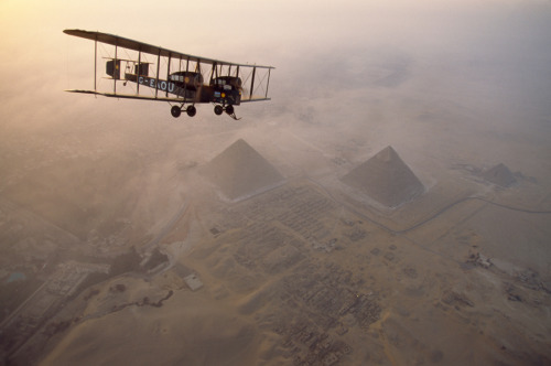 In the light of early morning, the Vimy circles the pyramids at Giza on a dawn tour, May 1995.Photog