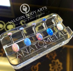 vaughnbodyarts:  New jewelry just added to the studio!  Brand new style from anatometal, oval-cut opal navel curves. All hand set in implant grade titanium.  Pictured from left; pink opal, light blue opal, light purple opal, dark blue opal, and white