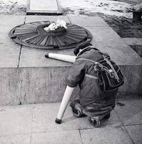 Photo of a Soviet war veteran near the Eternal Flame on the anniversary of Victory Day. 1966 Nudes & Noises  