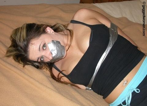 A fresh face gagged with some fresh tape.