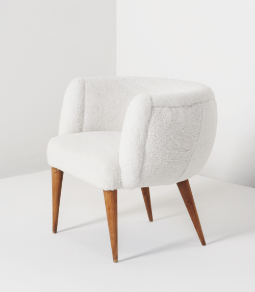 Jean Royère, Boule armchair, 1950. Sheepskin, oak. Via Phillips auctions, estimate: $40.000-60.000