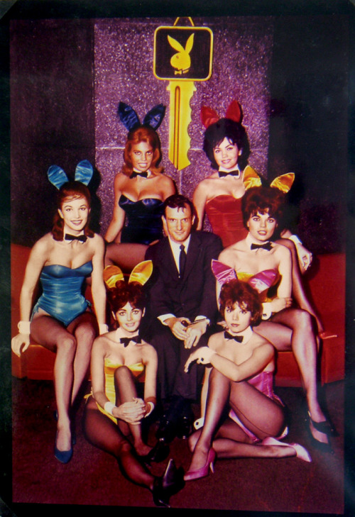 Hugh Hefner with of his Playboy Bunnies at the Chicago Club, 1960 