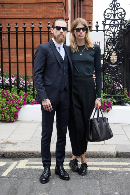 what-do-i-wear:  Justin O’Shea and Veronica Heilbrunner Justin is wearing an Acne suit with a Prada shirt, tie and shoes & Veronica is wearing a top from Nike and trousers are by Celine. (image: vogue)  